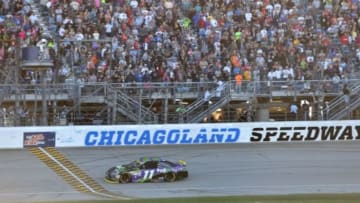 Sep 20, 2015; Joliet, IL, USA; NASCAR Sprint Cup Series driver Denny Hamlin (11) crosses the finish line to win the MyAFibRisk.com 400 at Chicagoland Speedway. Mandatory Credit: Jasen Vinlove-USA TODAY Sports