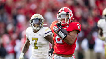 ATHENS, GA - NOVEMBER 26: Kendall Milton #2 of the Georgia Bulldogs outruns the defense for a touchdown during a game between Georgia Tech Yellow Jackets and Georgia Bulldogs at Sanford Stadium on November 26, 2022 in Athens, Georgia. (Photo by Steve Limentani/ISI Photos/Getty Images)
