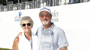 MADISON, WISCONSIN - JUNE 13: Jerry Kelly of the United States poses with the winners trophy with his mother Lee Kelly on the 18th green after winning the American Family Insurance Championship at University Ridge Golf Course on June 13, 2021 in Madison, Wisconsin. (Photo by Patrick McDermott/Getty Images)