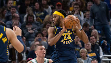 Feb 27, 2022; Indianapolis, Indiana, USA; Indiana Pacers forward Isaiah Jackson (23) catches the ball while Boston Celtics guard Payton Pritchard (11) defends in the second half at Gainbridge Fieldhouse. Mandatory Credit: Trevor Ruszkowski-USA TODAY Sports