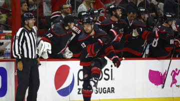 RALEIGH, NORTH CAROLINA - MAY 14: Max Domi #13 of the Carolina Hurricanes celebrates a second period goal in Game Seven of the First Round of the 2022 Stanley Cup Playoffs against the Boston Bruins at PNC Arena on May 14, 2022 in Raleigh, North Carolina. (Photo by Jared C. Tilton/Getty Images)