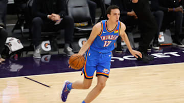 PHOENIX, ARIZONA - APRIL 02: Aleksej Pokusevski #17 of the Oklahoma City Thunder handles the ball against the Phoenix Suns during the NBA game at Phoenix Suns Arena on April 02, 2021 in Phoenix, Arizona. The Suns defeated the Thunder 140-103. NOTE TO USER: User expressly acknowledges and agrees that, by downloading and or using this photograph, User is consenting to the terms and conditions of the Getty Images License Agreement. (Photo by Christian Petersen/Getty Images)
