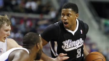 Mar 11, 2014; Auburn Hills, MI, USA; Sacramento Kings small forward Rudy Gay (8) defended by Detroit Pistons power forward Greg Monroe (middle) and small forward Kyle Singler (left) during the third quarter at The Palace of Auburn Hills. Pistons beat the Kings 99-89. Mandatory Credit: Raj Mehta-USA TODAY Sports