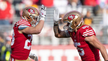 Dec 24, 2022; Santa Clara, California, USA; San Francisco 49ers running back Christian McCaffrey (23) and tight end George Kittle (85) celebrate during the second quarter against the Washington Commanders at Levi's Stadium. Mandatory Credit: Stan Szeto-USA TODAY Sports