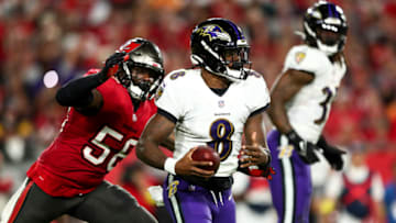 TAMPA, FL - OCTOBER 27: Lamar Jackson #8 of the Baltimore Ravens scrambles with the ball as Shaquil Barrett #58 of the Tampa Bay Buccaneers chases during an NFL football game at Raymond James Stadium on October 27, 2022 in Tampa, Florida. (Photo by Kevin Sabitus/Getty Images)
