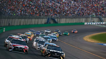 SPARTA, KENTUCKY - JULY 08: Martin Truex Jr., driver of the #78 Furniture Row/Denver Mattress Toyota, and Kyle Busch, driver of the #18 Snickers Toyota, lead the field during the Monster Energy NASCAR Cup Series Quaker State 400 presented by Advance Auto Parts at Kentucky Speedway on July 8, 2017 in Sparta, Kentucky. (Photo by Brian Lawdermilk/Getty Images)