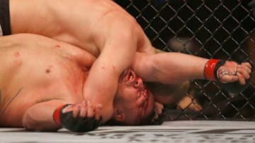 MELBOURNE, AUSTRALIA - OCTOBER 06: Serghei Spivac of Moldova chokes Tai Tuivasa of Australia between in their Heavyweight bout during UFC 243 at Marvel Stadium on October 06, 2019 in Melbourne, Australia. (Photo by Darrian Traynor/Getty Images)