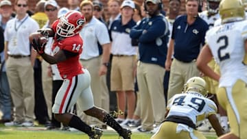 Nov 28, 2015; Atlanta, GA, USA; Georgia Bulldogs cornerback Malkom Parrish (14) intercepts a pass intended for Georgia Tech Yellow Jackets running back Clinton Lynch (49) on the final play of the game during the second half at Bobby Dodd Stadium. Georgia defeated Georgia Tech 13-7. Mandatory Credit: Dale Zanine-USA TODAY Sports