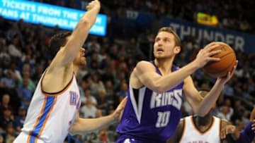 Apr 10, 2015; Oklahoma City, OK, USA; Sacramento Kings guard Nik Stauskas (10) drives to the basket against Oklahoma City Thunder forward Nick Collison (4) during the second quarter at Chesapeake Energy Arena. Mandatory Credit: Mark D. Smith-USA TODAY Sports
