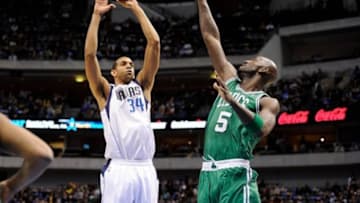 Mar 22, 2013; Dallas, TX, USA; Dallas Mavericks center Brandan Wright (34) shoots over Boston Celtics center Kevin Garnett (5) during the first quarter at the American Airlines Center. Mandatory Credit: Jerome Miron-USA TODAY Sports