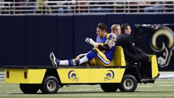 Dec 22, 2013; St. Louis, MO, USA; St. Louis Rams tackle Jake Long (77) is taken off the field during the first half against the Tampa Bay Buccaneers at the Edward Jones Dome. Mandatory Credit: Jeff Curry-USA TODAY Sports