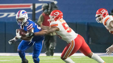 Oct 19, 2020; Orchard Park, New York, USA; Buffalo Bills running back Zack Moss (20) runs against Kansas City Chiefs inside linebacker Anthony Hitchens (53) in the fourth quarter at Bills Stadium. Mandatory Credit: Mark Konezny-USA TODAY Sports