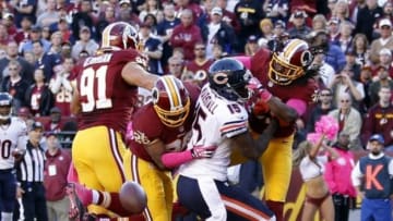 Oct 20, 2013; Landover, MD, USA; Washington Redskins strong safety Brandon Meriweather (31) knocks the ball from Chicago Bears wide receiver Brandon Marshall (15) in the end zone in the fourth quarter at FedEx Field. Merriweather was called for a penalty on the play. The Redskins won 45-41. Mandatory Credit: Geoff Burke-USA TODAY Sports