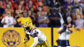 Oct 2, 2021; Baton Rouge, Louisiana, USA; Auburn football cornerback Jaylin Simpson (36) tackles LSU Tigers wide receiver Brian Thomas Jr. (11) during the second half at Tiger Stadium. Mandatory Credit: Stephen Lew-USA TODAY Sports