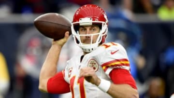 Jan 9, 2016; Houston, TX, USA; Kansas City Chiefs quarterback Alex Smith (11) throws a pass against the Houston Texans during the first quarter in a AFC Wild Card playoff football game at NRG Stadium. Mandatory Credit: John David Mercer-USA TODAY Sports