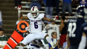 Adrian Hardy #6 of the Louisiana Tech Bulldogs celebrates after J'Mar Smith #8 ran the ball in from 12 yards out (Photo by Bob Levey/Getty Images)