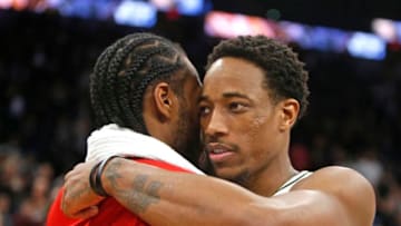 DeMar DeRozan #10 of the San Antonio Spurs greets Kawhi Leonard #2 of the Toronto Raptors at the end of the game at AT&T Center. (Photo by Ronald Cortes/Getty Images)