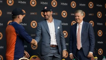 HOUSTON, TX - SEPTEMBER 03: Justin Verlander , center, along with manager A.J. Hinch, left, and general manager Jeff Luhnow during a press conference to officially introduce Verlander at Minute Maid Park on September 3, 2017 in Houston, Texas. (Photo by Bob Levey/Getty Images)