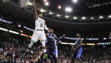 Dec 12, 2012; Boston, MA, USA; Boston Celtics point guard Rajon Rondo (9) drives the ball to the basket against Dallas Mavericks shooting guard O.J. Mayo (32) during the second overtime at the TD Garden. Celtics defeated the Mavericks in double overtime 117-115. Mandatory Credit: David Butler II-USA TODAY Sports