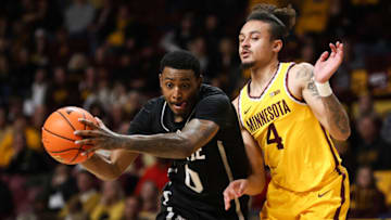 Dec 11, 2022; Minneapolis, Minnesota, USA; Mississippi State Bulldogs forward D.J. Jeffries (0) drives to the basket while Minnesota Golden Gophers guard Braeden Carrington (4) defends during the second half at Williams Arena. Mandatory Credit: Matt Krohn-USA TODAY Sports