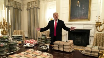WASHINGTON, DC - JANUARY 14: (AFP OUT) U.S President Donald Trump presents fast food to be served to the Clemson Tigers football team to celebrate their Championship at the White House on January 14, 2019 in Washington, DC. (Photo by Chris Kleponis-Pool/Getty Images)