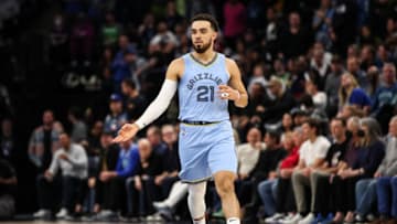 MINNEAPOLIS, MN - APRIL 23: Tyus Jones #21 of the Memphis Grizzlies celebrates a three-point basket against the Minnesota Timberwolves in the second quarter of the game during Game Four of the Western Conference First Round at Target Center on April 23, 2022 in Minneapolis, Minnesota. NOTE TO USER: User expressly acknowledges and agrees that, by downloading and or using this Photograph, user is consenting to the terms and conditions of the Getty Images License Agreement. (Photo by David Berding/Getty Images)