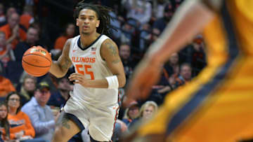 Nov 11, 2022; Champaign, Illinois, USA; Illinois Fighting Illini guard Skyy Clark (55) drives the ball up court against the UMKC Kangaroos (33)during the first half at State Farm Center. Mandatory Credit: Ron Johnson-USA TODAY Sports