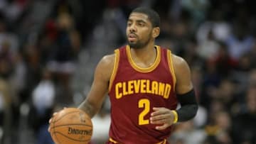Dec 30, 2014; Atlanta, GA, USA; Cleveland Cavaliers guard Kyrie Irving (2) dribbles the ball against the Atlanta Hawks in the first quarter at Philips Arena. Mandatory Credit: Brett Davis-USA TODAY Sports