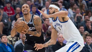 The Sacramento Kings' George Hill is fouled by the Golden State Warriors' JaVale McGee (1) in the first quarter at Golden 1 Center in Sacramento, Calif., on Friday, Feb. 2, 2018. (Hector Amezcua/Sacramento Bee/TNS via Getty Images)