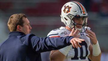 Auburn football offensive coordinator Kenny Dillingham talks with Auburn quarterback Bo Nix (10) during warm ups at Donald W. Reynolds Razorback in Fayetteville, Ark., on Saturday, Oct. 19, 2019.