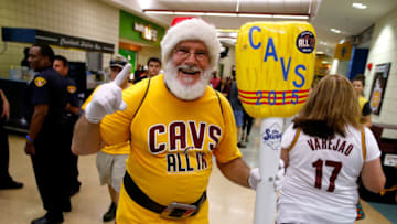 CLEVELAND, OH - MAY 26: A Cleveland Cavaliers fan dressed as Santa Claus holds an inflatable broom before Game Four of the Eastern Conference Finals against the Atlanta Hawks of the 2015 NBA Playoffs at Quicken Loans Arena on May 26, 2015 in Cleveland, Ohio. NOTE TO USER: User expressly acknowledges and agrees that, by downloading and or using this Photograph, user is consenting to the terms and conditions of the Getty Images License Agreement. (Photo by Gregory Shamus/Getty Images)
