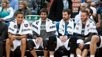 Nov 1, 2013; Minneapolis, MN, USA; (l. to r.) Minnesota Timberwolves shooting guard Kevin Martin (23), point guard Ricky Rubio (9), power forward Kevin Love (42) and point guard J.J. Barea (11) during the final minutes of the fourth quarter against the Oklahoma City Thunder at Target Center. Timberwolves won 100-81. Mandatory Credit: Greg Smith-USA TODAY Sports