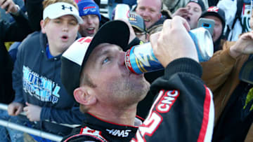 MARTINSVILLE, VA - MARCH 26: Clint Bowyer, driver of the #14 Haas Automation Demo Day Ford, celebrates winning the weather delayed Monster Energy NASCAR Cup Series STP 500 at Martinsville Speedway on March 26, 2018 in Martinsville, Virginia. (Photo by Sarah Crabill/Getty Images)
