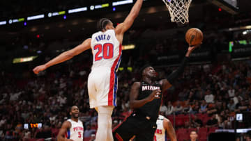 Miami Heat guard Victor Oladipo (4) shoots the ball around Detroit Pistons forward Kevin Knox II (20)(Jasen Vinlove-USA TODAY Sports)