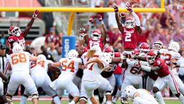 DALLAS, TX - OCTOBER 06: Cameron Dicker #17 of the Texas Longhorns kicks the game-winning field goal against the Oklahoma Sooners in the fourth quarter of the 2018 AT&T Red River Showdown at Cotton Bowl on October 6, 2018 in Dallas, Texas. (Photo by Tom Pennington/Getty Images)