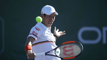 NEWPORT BEACH, CA - JANUARY 23: Kei Nishikori of Japan returns a backhand volley to Dennis Novikov during the first round of the Oracle Challenger Series at the Newport Beach Tennis Club on January 23, 2018 in Newport Beach, California. (Photo by Jeff Gross/Getty Images)