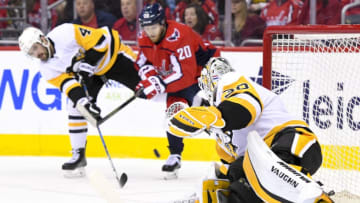 WASHINGTON, DC - APRIL 29: Pittsburgh Penguins defenseman Justin Schultz (4) defends a first period shot by Washington Capitals center Lars Eller (20) that is saved by goaltender Matt Murray (30) on April 29, 2018, at the Capital One Arena in Washington, D.C. in the Second Round of the Stanley Cup Playoffs. The Washington Capitals defeated the Pittsburgh Penguins, 4-1. (Photo by Mark Goldman/Icon Sportswire via Getty Images)