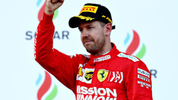 BAKU, AZERBAIJAN - APRIL 28: Third placed finisher Sebastian Vettel of Germany and Ferrari celebrates on the podium during the F1 Grand Prix of Azerbaijan at Baku City Circuit on April 28, 2019 in Baku, Azerbaijan. (Photo by Mark Thompson/Getty Images)