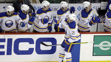 Nov 16, 2021; Pittsburgh, Pennsylvania, USA; Buffalo Sabres right wing Kyle Okposo (21) celebrates his goal with teammates during the second period against the Pittsburgh Penguins at PPG Paints Arena. Mandatory Credit: Charles LeClaire-USA TODAY Sports