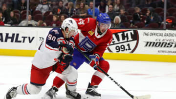 CLEVELAND, OH - NOVEMBER 09: Laval Rocket center Daniel Audette (24) plays the puck as Cleveland Monsters left wing Nathan Gerbe (90) defends during the third period the American Hockey League game between the Laval Rocket and Cleveland Monsters on November 9, 2018, at Quicken Loans Arena in Cleveland, OH. (Photo by Frank Jansky/Icon Sportswire via Getty Images)