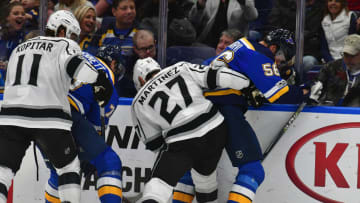 ST. LOUIS, MO - OCTOBER 30: Los Angeles Kings center Anze Kopitar (11) and Los Angeles Kings defenseman Alec Martinez (27) battle with St. Louis Blues left wing Magnus Paajarvi (56) and St. Louis Blues right wing Beau Bennett (78) on the boards for the puck during a National Hockey League game between the Los Angeles Kings and the St. Louis Blues on October 30, 2017, at Scottrade Center, St. Louis, MO. (Photo by Keith Gillett/Icon Sportswire via Getty Images)