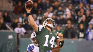 Dec 5, 2016; East Rutherford, NJ, USA; New York Jets quarterback Ryan Fitzpatrick (14) is hit by Indianapolis Colts defensive tackle Hassan Ridgeway (91) as he throws a pass during the first half at MetLife Stadium. Mandatory Credit: Ed Mulholland-USA TODAY Sports