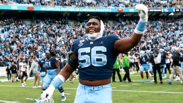 CHAPEL HILL, NORTH CAROLINA - NOVEMBER 06: Tomari Fox #56 of the North Carolina Tar Heels reacts after a win against the Wake Forest Demon Deacons during their game at Kenan Memorial Stadium on November 06, 2021 in Chapel Hill, North Carolina. The Tar Heels won 58-55. (Photo by Grant Halverson/Getty Images)