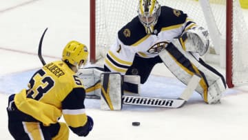 Apr 25, 2021; Pittsburgh, Pennsylvania, USA; Boston Bruins goaltender Jeremy Swayman (1) makes a stick save against Pittsburgh Penguins center Teddy Blueger (53) during the first period at PPG Paints Arena. Mandatory Credit: Charles LeClaire-USA TODAY Sports