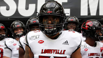 MIAMI, FLORIDA - NOVEMBER 09: Dayna Kinnaird #57 of the Louisville Cardinals waits to take the field prior to the game against the Miami Hurricanes at Hard Rock Stadium on November 09, 2019 in Miami, Florida. (Photo by Michael Reaves/Getty Images)