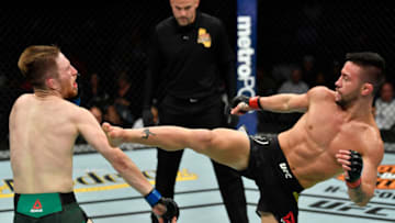LOS ANGELES, CA - AUGUST 04: (R-L) Pedro Munhoz of Brazil kicks Brett Johns of Wales in their bantamweight fight during the UFC 227 event inside Staples Center on August 4, 2018 in Los Angeles, California. (Photo by Jeff Bottari/Zuffa LLC/Zuffa LLC via Getty Images)