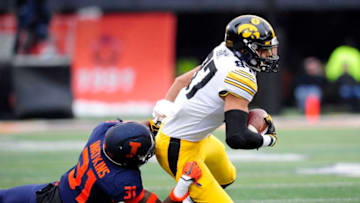 CHAMPAIGN, IL - NOVEMBER 17: Illinois Fighting Illini defensive back Cameron Watkins (31) tackles Iowa Hawkeyes tight end Noah Fant (87) during the Big Ten Conference college football game between the Iowa Hawkeyes and the Illinois Fighting Illini on November 17, 2018, at Memorial Stadium in Champaign, Illinois. (Photo by Michael Allio/Icon Sportswire via Getty Images)