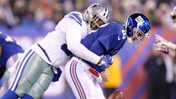 Dec 11, 2016; East Rutherford, NJ, USA; New York Giants quarterback Eli Manning (10) fumbles as he is hit by Dallas Cowboys defensive end Benson Mayowa (93) during the second quarter at MetLife Stadium. Mandatory Credit: Brad Penner-USA TODAY Sports