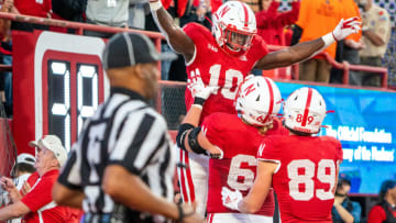 Nebraska football running back Anthony Grant (10) celebrates with offensive lineman Turner Corcoran (69) and wide receiver Oliver Martin (89) after a touchdown run (Dylan Widger-USA TODAY Sports)