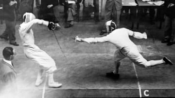 Two swordsmen participating in the fencing semifinals during the 1948 Summer Olympic Games in London.